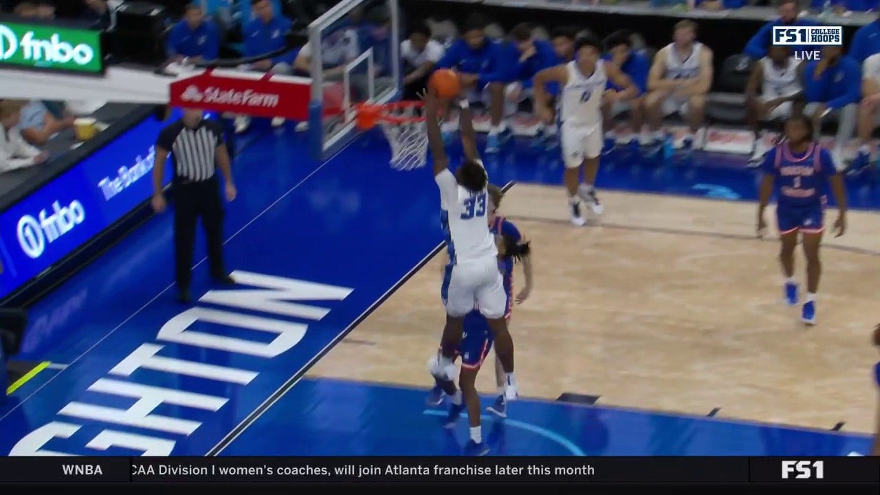 Fredrick King soars for a strong two-handed alley-oop to extend No. 14 Creighton's lead over HCU